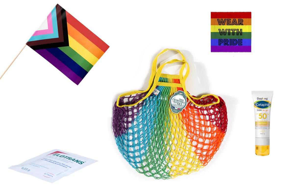 Collage der Pride Goodie Bag der Marien Apotheke Wien. Das Bild enthält eine Regenbogenfahne, eine Netztasche in Regenbogenfarben, eine Sonnencreme, Elektrolytlösung und ein Kondom mit der Aufschrift